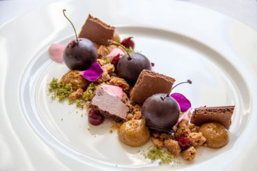Cherry mousse with creamy caramel and cinnamon biscuit.
